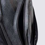 Grey school bag showing zip detail with grey background