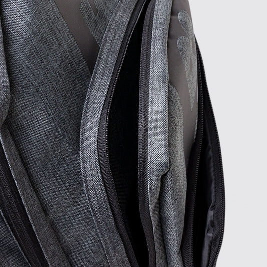Grey school bag showing zip detail with grey background
