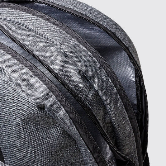 Grey school bag showing zip detail with grey background