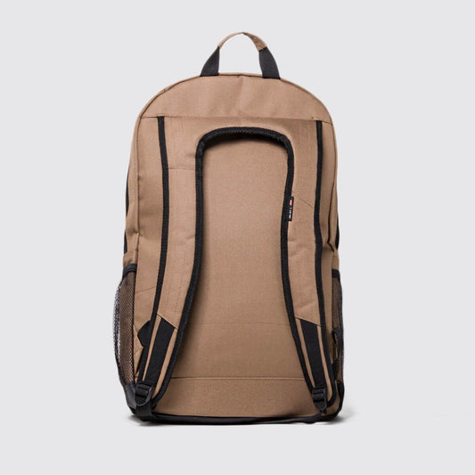 A tan canvas backpack shown from the back, featuring black padded shoulder straps, side mesh pockets, and a top carry handle, set against a light gray background.
