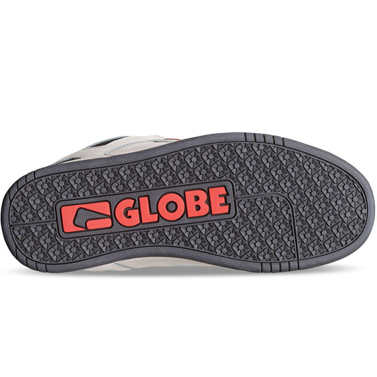 Globe logo on the sole of a shoe with a white background