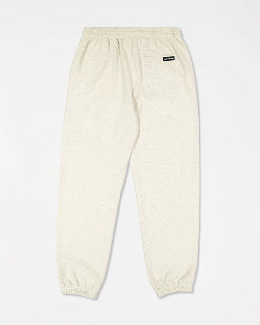 Beige sweatpants with a small logo on a white background