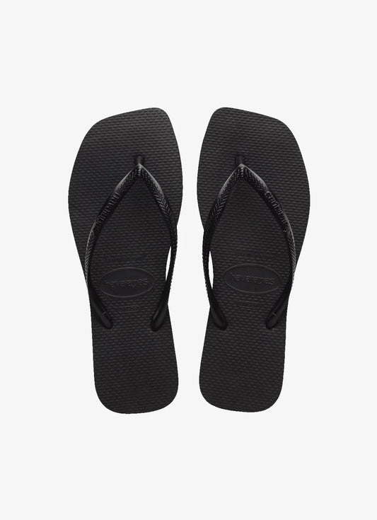 Pair of black flip-flops on a white background