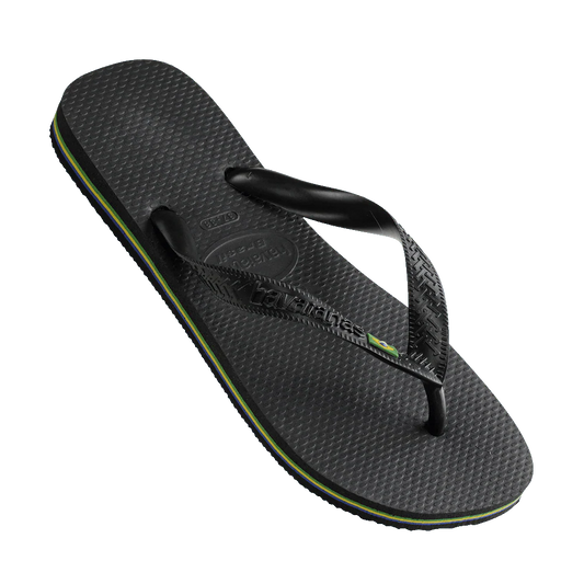 Black sandal with a textured sole on a white background