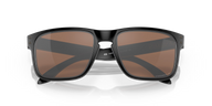 Black sunglasses with brown lenses on a black background
