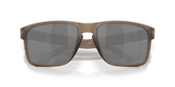 A pair of oversized square sunglasses with a translucent taupe-brown frame and dark gray lenses, shown from a front-facing perspective on a clean white background.