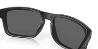 Black sunglasses with a reflective surface on a white background