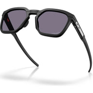 Black square aviator-style sunglasses with dark gray lenses and a white side temple detail, shown on a white background with a soft shadow.