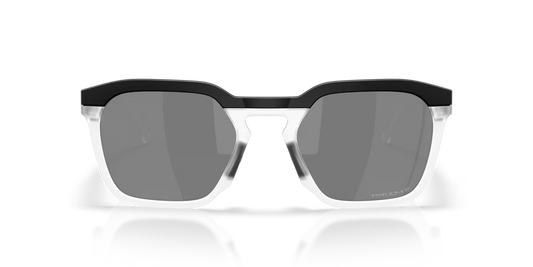 Sunglasses with black and clear frame on a reflective surface