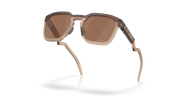 Sunglasses with brown lenses and beige frame on a white background