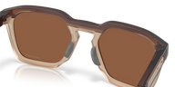 Sunglasses with brown lenses and beige frame on a clear background