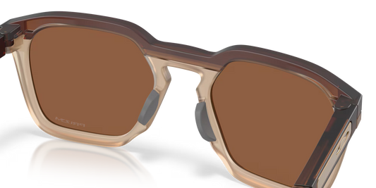 Sunglasses with brown lenses and beige frame on a clear background