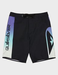 Black board shorts with colorful design and Quicksilver branding on a white background