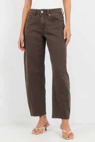 Brown jeans worn by a person on a white background