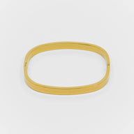 Gold bangle on a white background