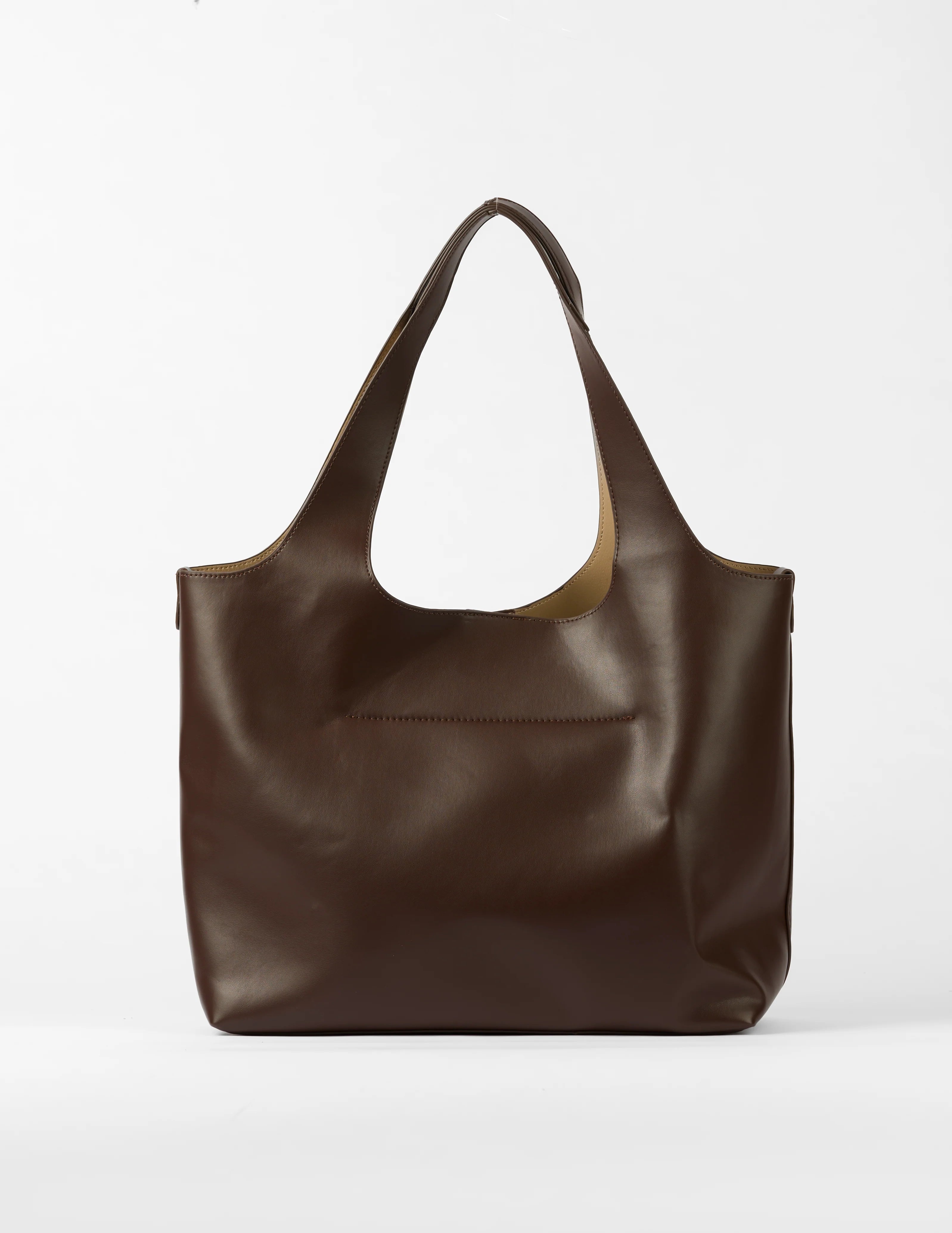 Brown leather tote bag on a white background