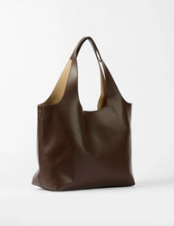 Brown leather handbag on a white background