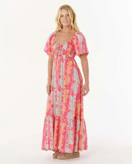 Woman wearing a colorful dress on a white background