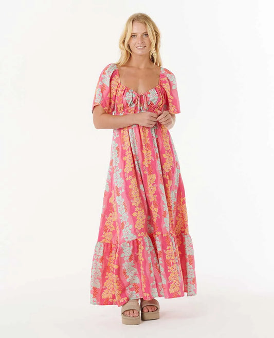 Woman wearing a pink floral dress on a white background