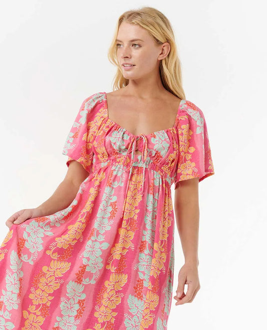 Woman wearing a pink floral dress on a white background