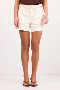 ecru coloured shorts on model 