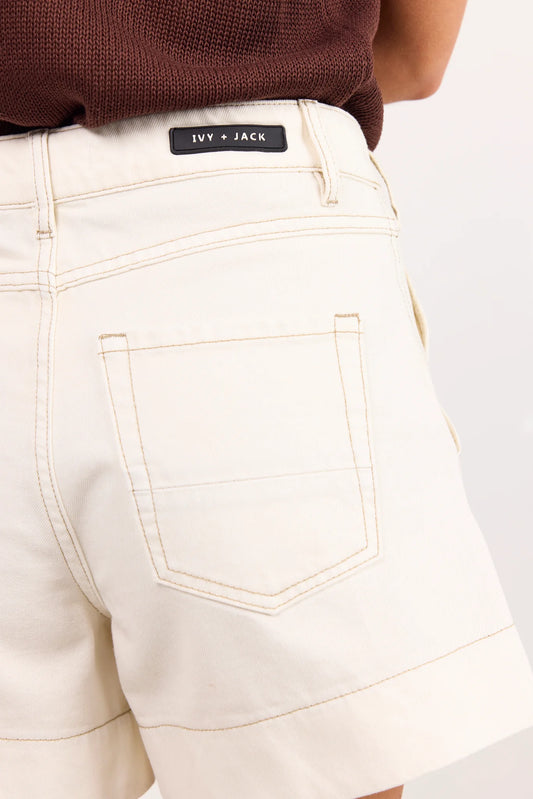 ecru coloured shorts on model 