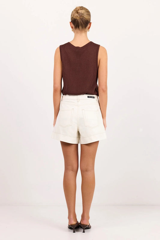 ecru coloured shorts on model 