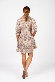 Woman wearing a floral dress on a white background