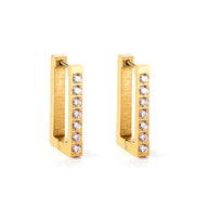 Gold hoop earrings with embedded diamonds on a white background