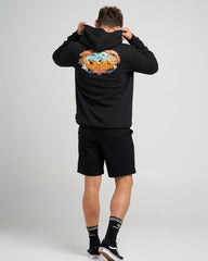 Person wearing a black hoodie with a colorful graphic on the back against a gray background
