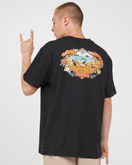 Person wearing a black t-shirt with a colorful graphic on the back, standing against a white background