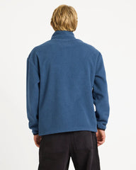 Person wearing a blue fleece jacket on a white background