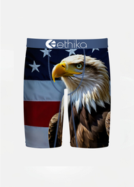Ethika boys boxer briefs featuring a detailed print of a bald eagle's head and feathers over an American flag background, with the Ethika brand logo on the waistband.
