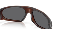 Brown sunglasses with a reflective surface on a clear background