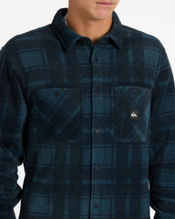 Blue plaid shirt with a brand logo on a white background