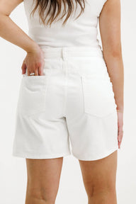 white denim shorts on female model