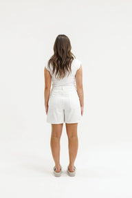 white denim shorts on female model