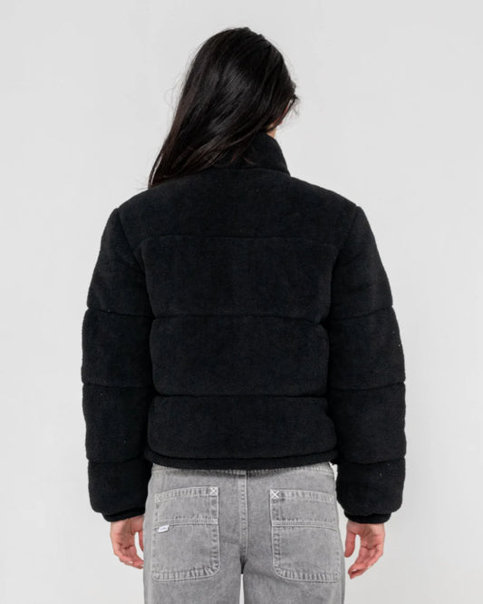 Person wearing a black puffer jacket on a white background