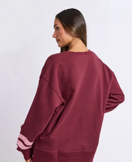 burgandy crew neck sweatshirt with pink writting