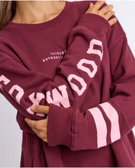burgandy crew neck sweatshirt with pink writting