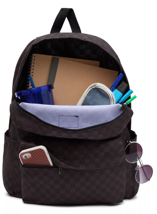 Black backpack with various items including a phone, sunglasses, and stationery on a white background