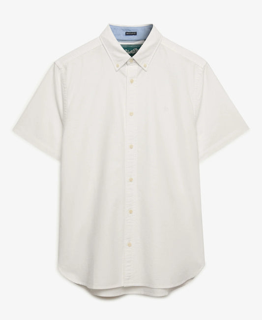 A short-sleeve button-down shirt in off-white, featuring a classic collar, matching buttons, and a visible light blue inner collar lining. The brand label inside the collar reads 'SUITABLE'.