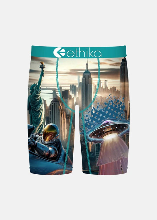 Boxer briefs with a cityscape and UFO design on a white background, featuring the brand 'ethika'.