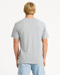 Person wearing a gray t-shirt and light blue jeans on a white background