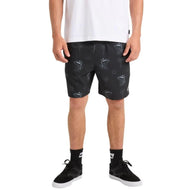 Person wearing black shorts with white patterns on a white background