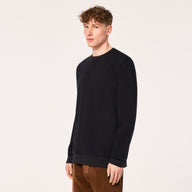 Person wearing a black sweatshirt on a white background