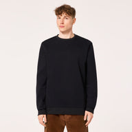 Person wearing a black sweatshirt on a plain background