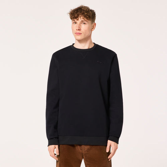 Person wearing a black sweatshirt on a plain background