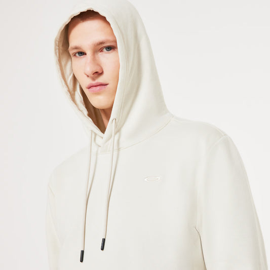 Person wearing a white hoodie on a light gray background