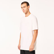 Man wearing a plain white t-shirt on a white background
